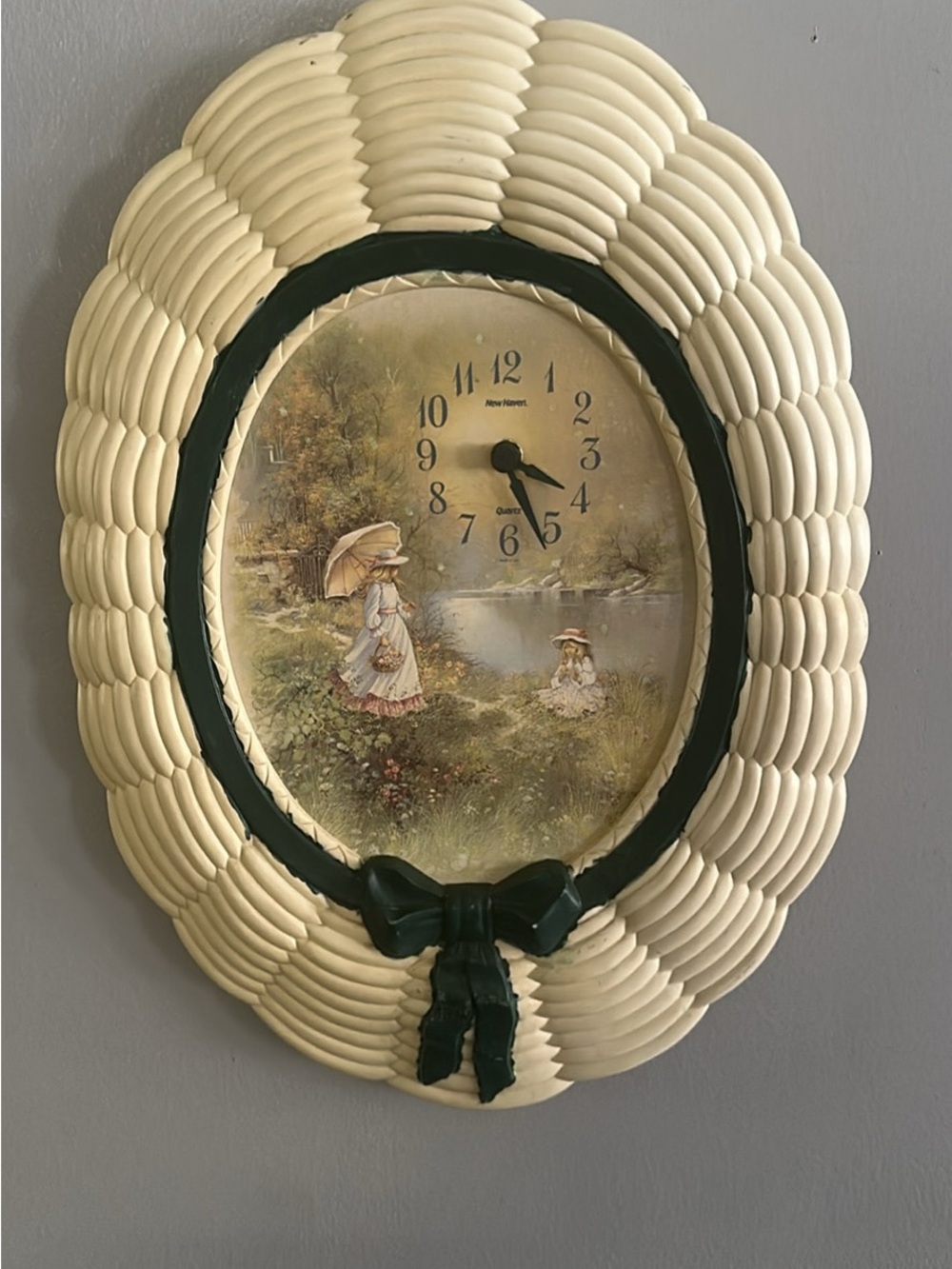 Vintage-Inspired Cream Wall Clock with Green Trim